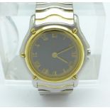 A lady's two tone stainless steel Ebel wristwatch, bezel and screws test as 18ct gold,