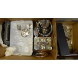 A box of plated ware including a six bottle cruet set and community plate, brass weights, glass,