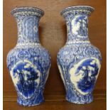 A pair of blue and white vases, one base marked C.