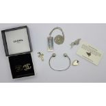 A pair of Chanel earrings, silver bangle,