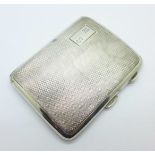 A silver cigarette case,