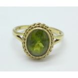 A 9ct gold and green stone ring, 4.