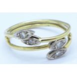 A yellow metal and diamond ring, tests as 18ct gold,