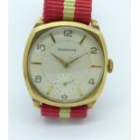 A 9ct gold cased Garrard wristwatch, the case back bears inscription,