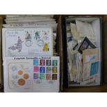 A box of Royal Mail first day covers and a box of loose stamps