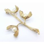 A hallmarked 9ct gold and pearl brooch, 4.