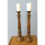 A pair of beech ecclesiastical candle stands