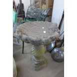 A concrete bird bath