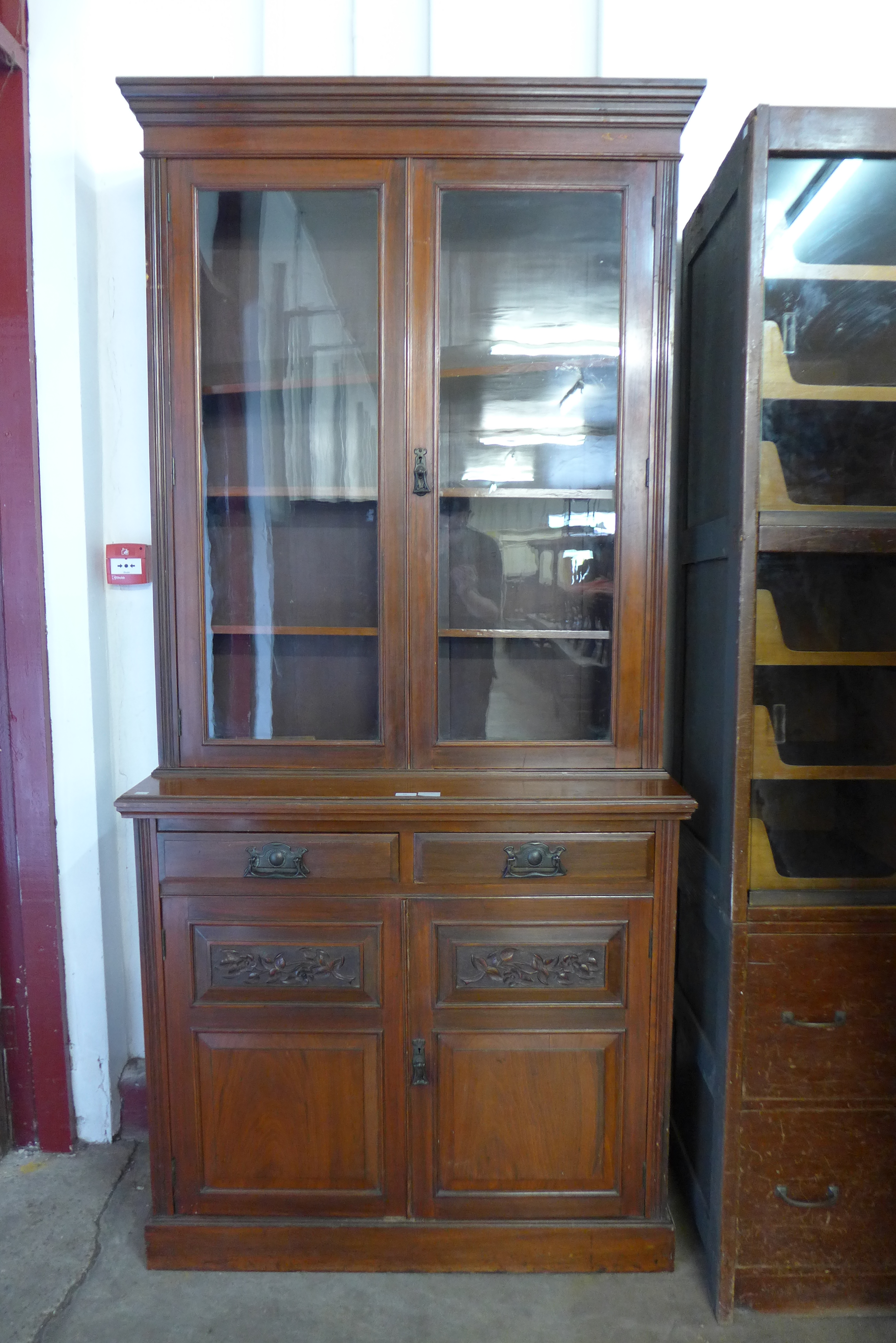 A Victorian carved walnut bookcase