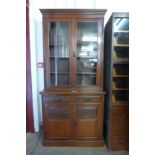 A Victorian carved walnut bookcase