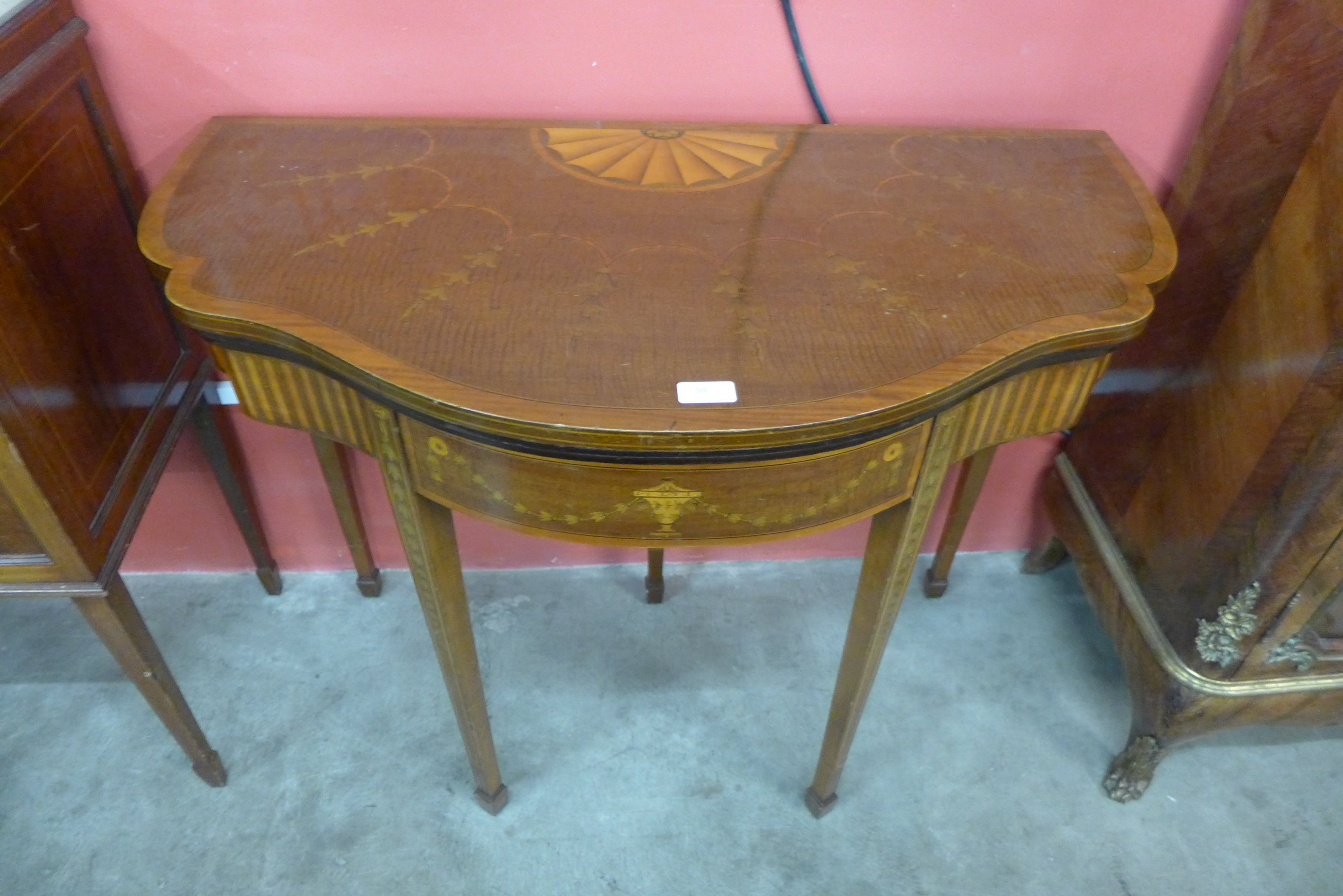 An Edward VII Sheraton Revival mahogany and marquetry inlaid fold-over card table