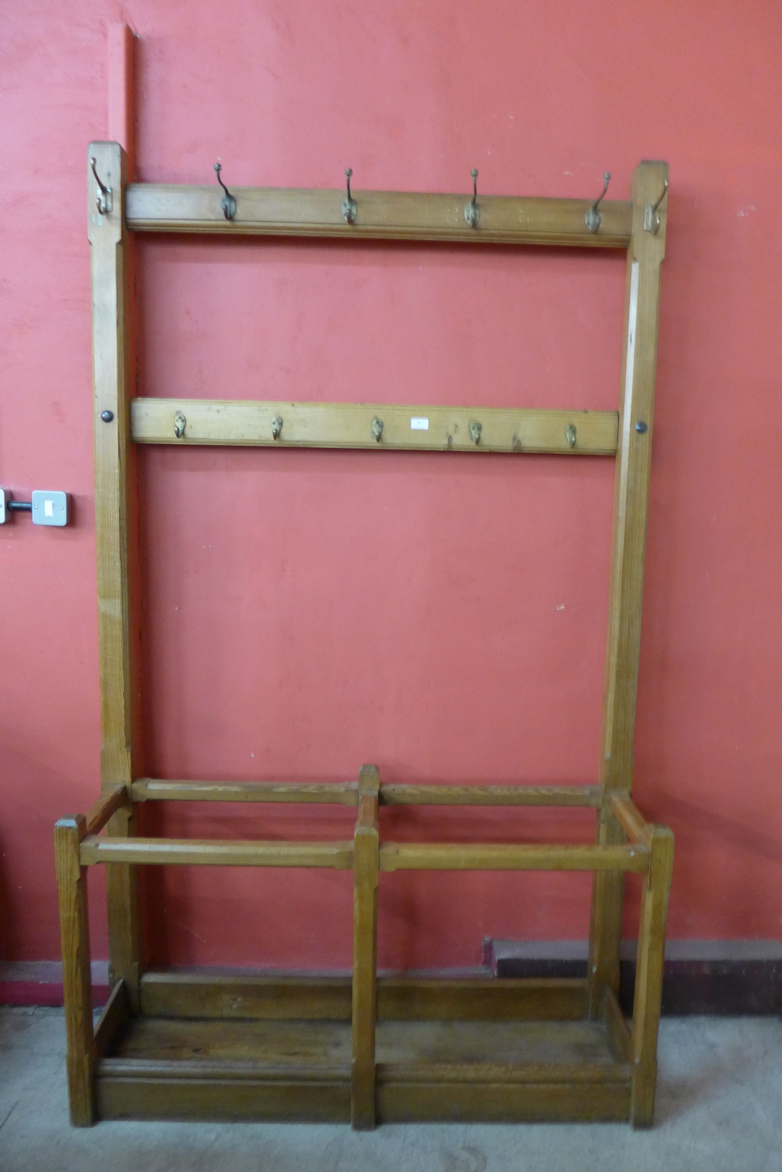 A Victorian pitch pine double hall stand