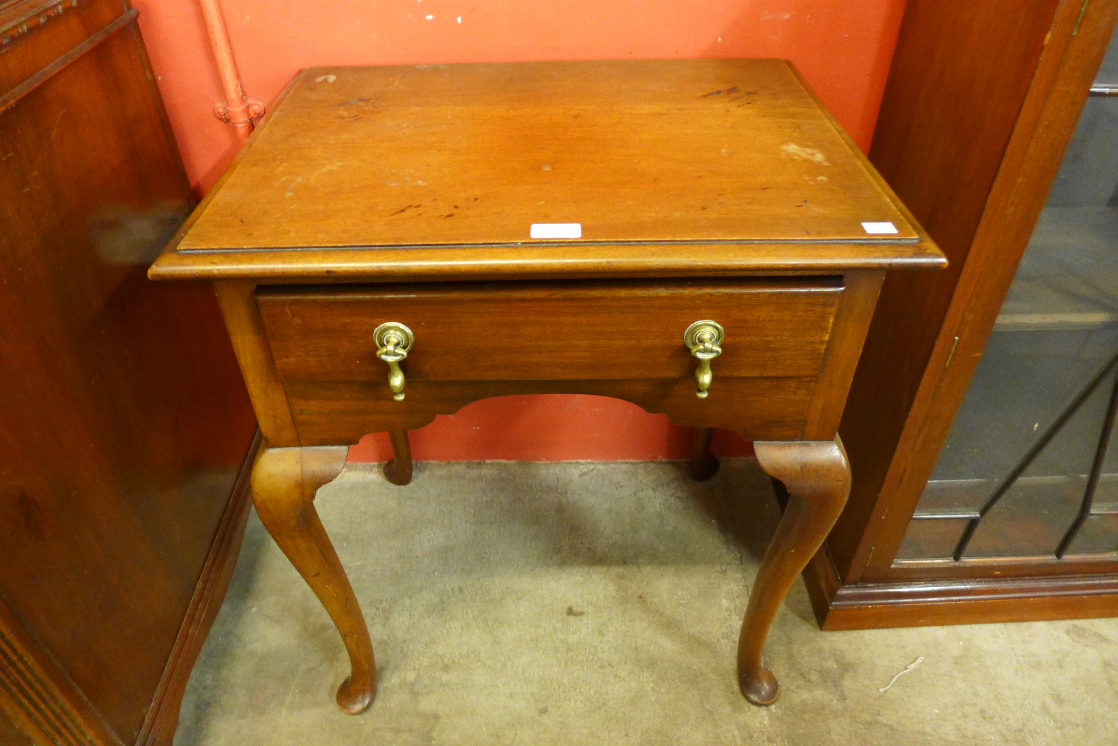 A George III style walnut lowboy