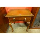 A George III style walnut lowboy