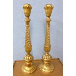 A pair of Italian giltwood ecclesiastical candle stands