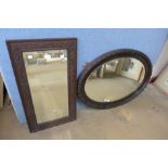 A carved oak mirror and one other