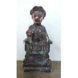 A small oriental carved wood figure