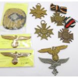 A collection of German cross and hat pins, etc.