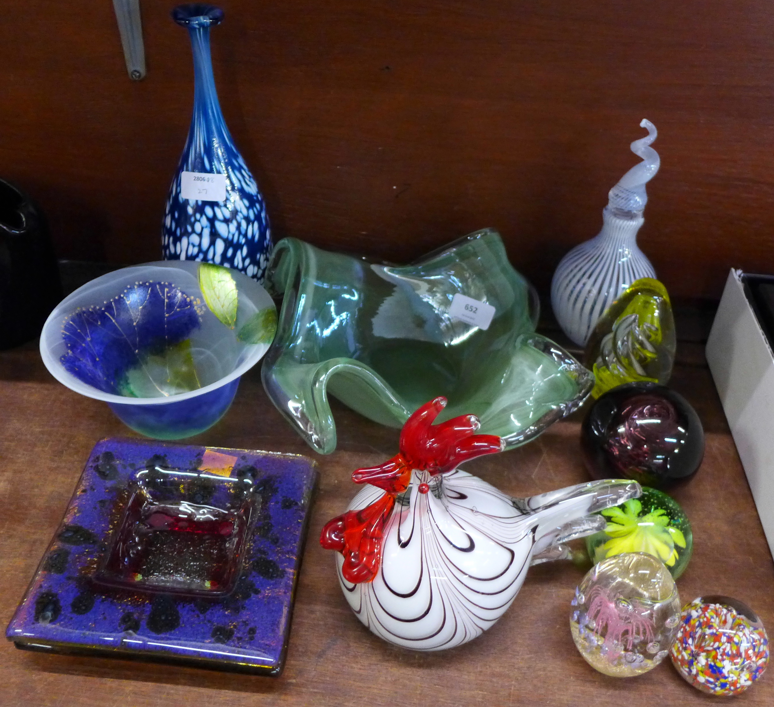 Twelve items of glass; cockerel, five paperweights, two ashtrays, a green studio glass bowl,