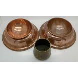 Two copper bowls and a decorated Eastern brass pot