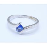 A 9ct white gold ring set with a sapphire, 2.