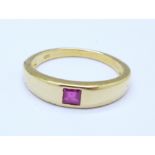 A silver gilt princess cut ruby solitaire ring,