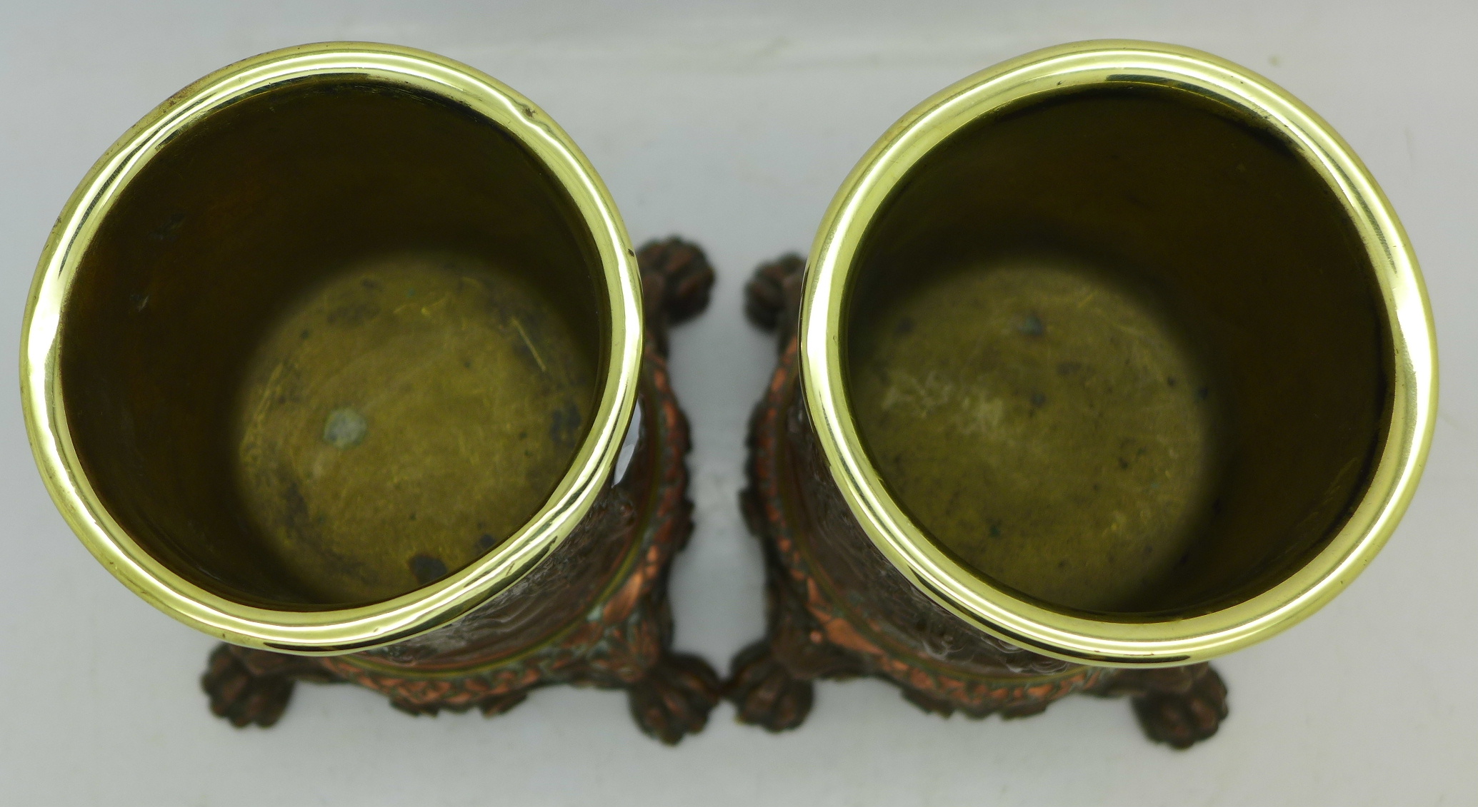 A pair of copper plated and brass lined candle holders with embossed tavern scenes, - Image 4 of 4