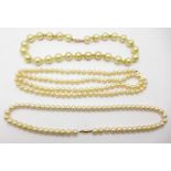 Three strings of faux pearls with 9ct gold clasp