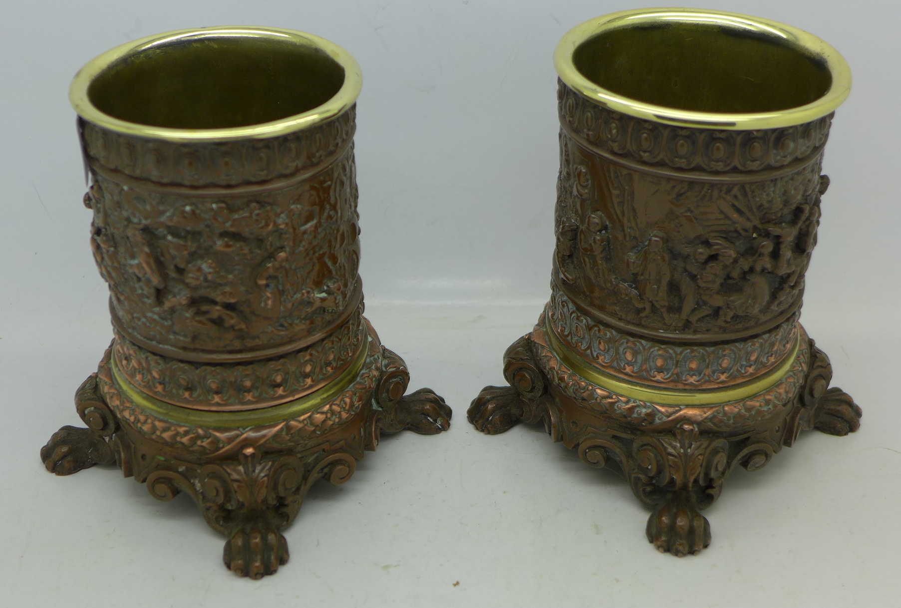 A pair of copper plated and brass lined candle holders with embossed tavern scenes, - Image 2 of 4