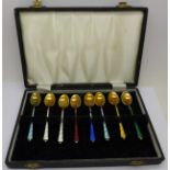 A set of eight silver and enamel coffee spoons, made in Denmark,
