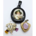 An oval jet memorial pendant with half portrait of a continental girl,