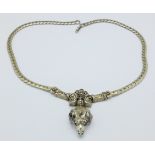 A continental white metal ram's head necklace, 45.