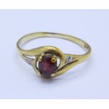 A 9ct gold and red stone ring, 1.