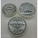 Three toothpaste advertising lids, W.