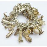 A heavy silver charm bracelet,