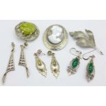 Three silver brooches and three pairs of silver earrings