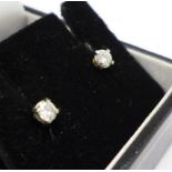 A pair of diamond stud earrings