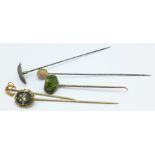 A 9ct gold stickpin and four others