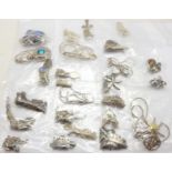 Twenty-five silver pendants and chains