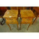 A pair of French walnut inlaid bedside tables