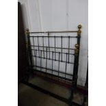 A Victorian cast steel and brass double bed