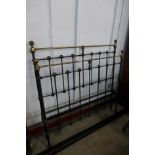 A Victorian cast steel and brass double bed