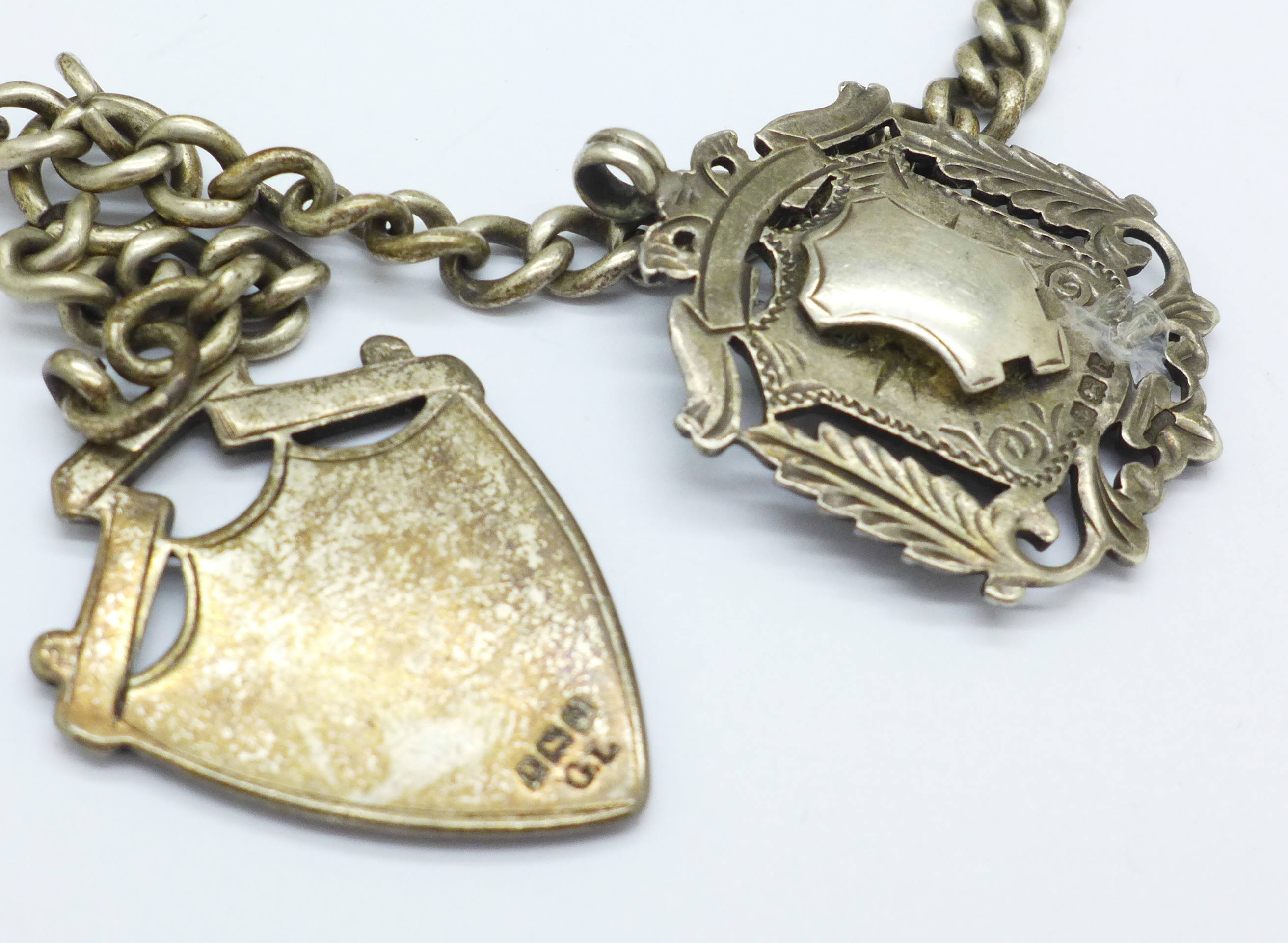 A silver chain, two silver fobs, a pair of silver cufflinks and a 'SOS' pendant, - Image 3 of 3