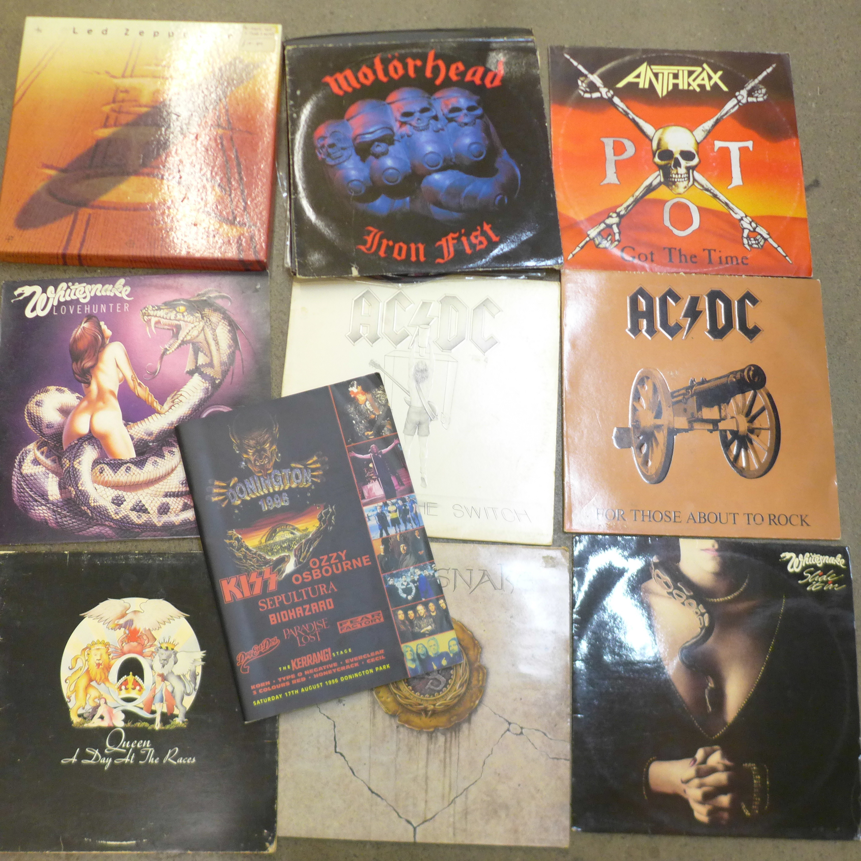 A collection of thirteen rock LP records including one Motorhead blue disc and picture discs,