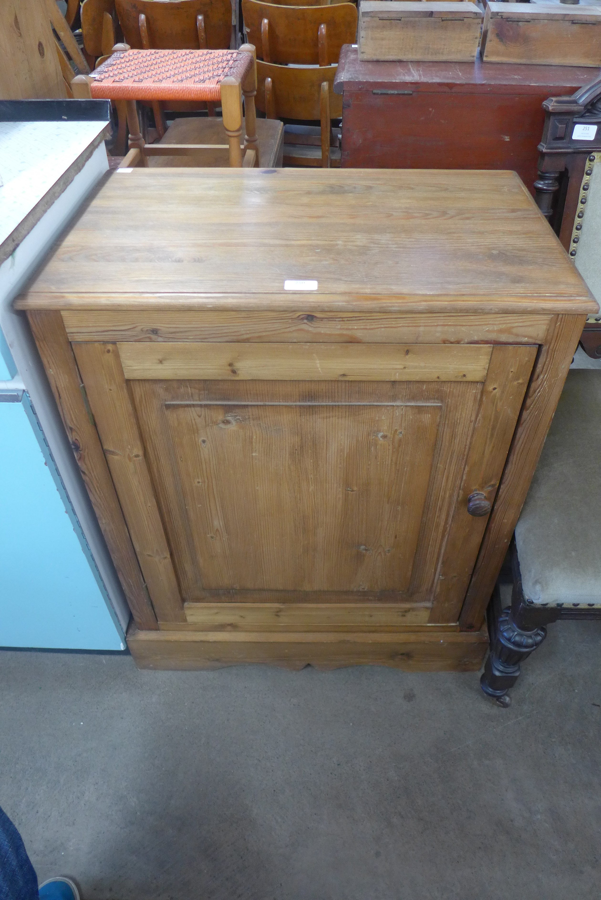 A pine single door cupboard