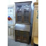 An Arts and Crafts oak bureau bookcase