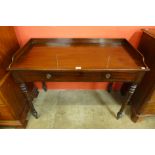 A Victorian mahogany single drawer writing table