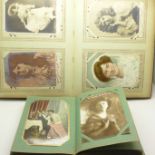 Two albums of approximately 150 postcards, Victorian and later,