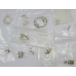 Fourteen pairs of silver earrings
