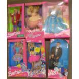 Five Barbie dolls and a Ken doll,